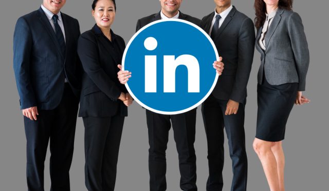 business-people-holding-linkedin-logo