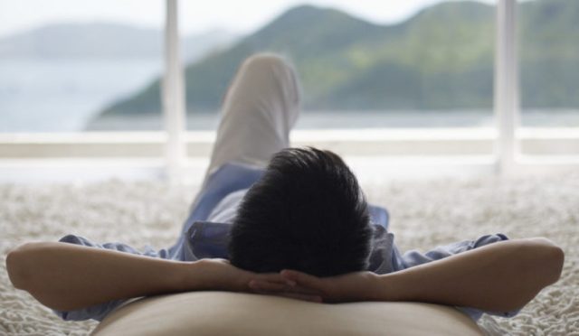 Man-Lying-Down-and-Looking-Out-of-Picture-Window-e1455205484733-940x470
