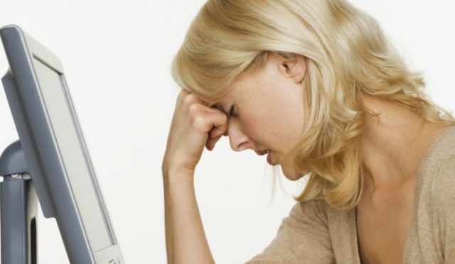 stress-female-at-desk-e1444575023647-900x450-940x470