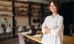 young-attractive-woman-white-shirt-dreamily-looking-camera-with-desk-background-modern-office
