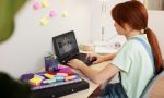 medium-shot-girl-typing-home