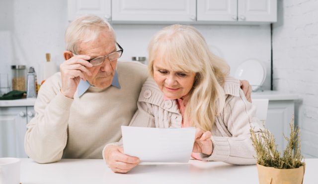 senior-couple-looking-paper