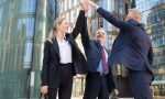 three-cheerful-businesspeople-giving-five-smiling-confident-happy-colleagues-celebrating-successful-deal-together-standing-outdoors-rising-hand-up-teamwork-partnership-concept - Kopya